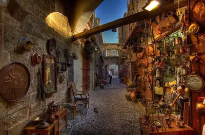 an alley in a building with a lot of items on the walls at Alchadef Park Apartment in Rhodes Town