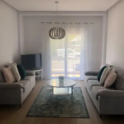 a living room with two couches and a coffee table at Appartement in Rhodos Stadt in Rhodes Town