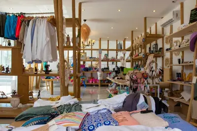 a store with a lot of clothes on shelves at Alia Beachfront Suites and Spa in Haraki