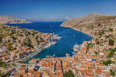 an aerial view of a harbor with boats in the water at Elena in Symi