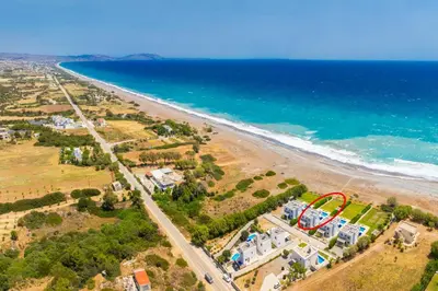 an aerial view of a beach with a roller coaster at Villa Tsampikos in Lachania