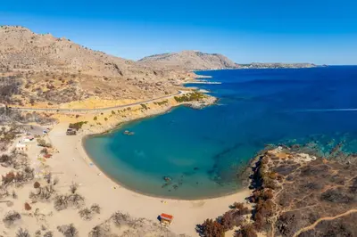 an aerial view of a beach with blue water at Villa Tsampikos in Lachania