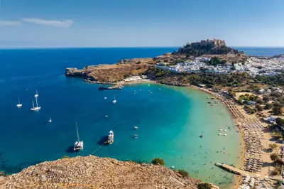 an aerial view of a beach with boats in the water at Villa Ammos in Afantou