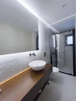 a bathroom with a white sink and a shower at AleNi City Apartment 2 in Rhodes Town