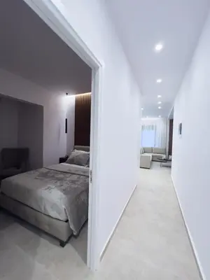 a bedroom with a bed and a hallway at AleNi City Apartment 2 in Rhodes Town