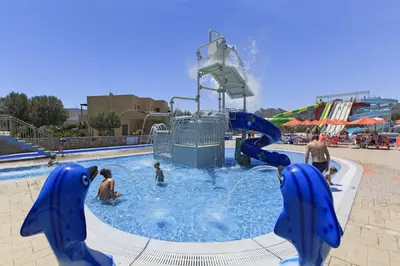 a group of people playing in a water park at Villa Elena in Kalathos