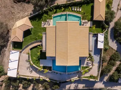 an aerial view of a house with a swimming pool at Vadis Luxury Villa Rhodes in Koskinou