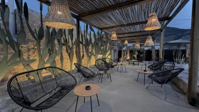 a group of chairs and tables in a patio at LA Casa Di Lusso Casa N8 Adults Only in Kolimbia