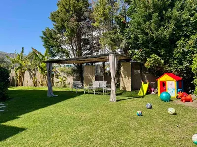 a backyard with a gazebo and a play house at Papas House 3 near Faliraki Kalithies in Kalithies