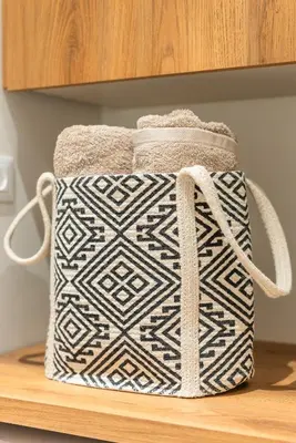a white and black bag sitting on a shelf at Stylish Suite in Rhodes Town