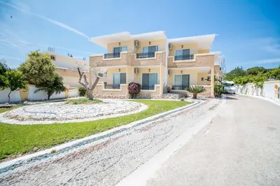 a house on the side of a road at Mosaic Gardens in Faliraki