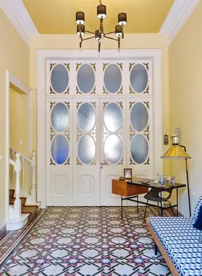 a room with a white door with round windows at Villa Sanyan - Adults Only in Rhodes Town