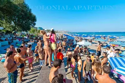a crowd of people on a crowded beach at Colonial Studio/Apartment in Faliraki