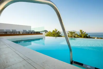 a swimming pool with a view of the ocean at Villa Serene with swimming pool in Lindos in Líndos