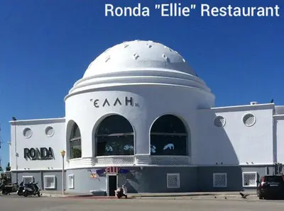 a white building with a dome on top of it at Apollon Apartments H-2 in Rhodes Town