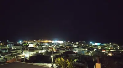 a view of a city at night at Rustic House in Émbonas