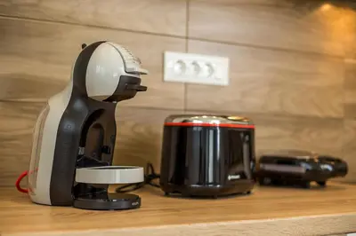 a coffee maker and toaster sitting on a counter at The Sisters Villa in Kalithies