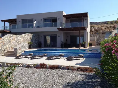 a group of birds sitting in front of a house at Villa Anna in Pefki Rhodes