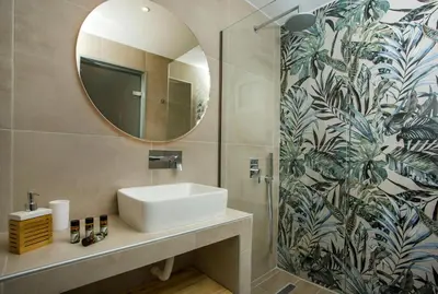 a bathroom with a sink and a mirror at Casa Stavris in Faliraki