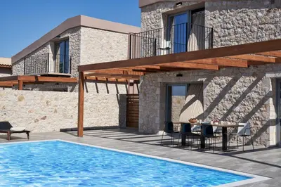 a villa with a swimming pool and a house at Anar Villas Rhodes in Koskinou