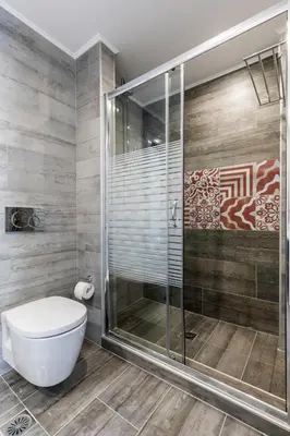 a bathroom with a shower and a toilet at Villa Estella with pool & jacuzzi in Lindos in Líndos