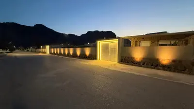 an empty street with a row of buildings with lights at LA Casa Di Lusso N5 - Adults Only in Kolimbia