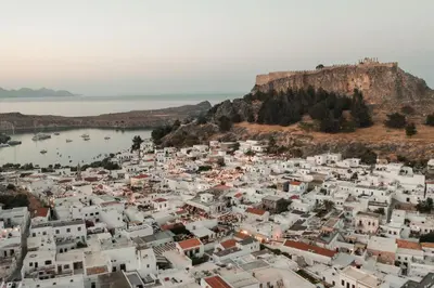 an aerial view of a town on a hill at Noema Lindos - Agapitos Apartment in Líndos