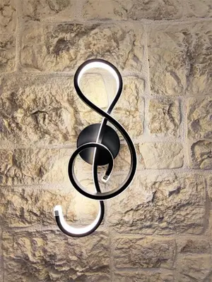 a metal light fixture hanging on a brick wall at Villa Pavlina in Ixia