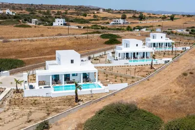 an aerial view of a white house with a pool at Seacarf Villa, 3 magnificent properties in Lachania beach, Bedrooms 12, Sleeps 27 in Lachania