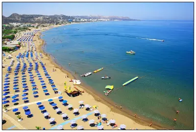 an aerial view of a beach with umbrellas and people at RHODIAN TREASURE Spiridione apartment in Rhodes Town