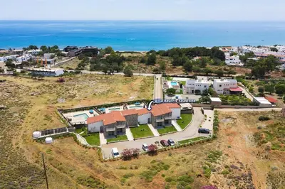 an aerial view of a house with the ocean at Villa Beatris Seastone by Villa Plus in Kiotari