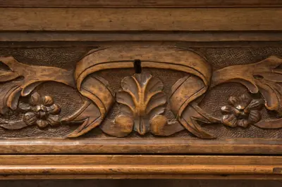 a wooden carving of flowers on a wall at Niochori Heritage: The Pianist Suite in Rhodes Town