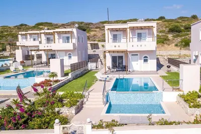 an aerial view of a house with two swimming pools at Villa Regina - Luxury and Comfort in Lachania
