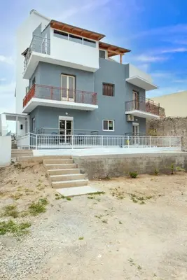 a large blue house with stairs in front of it at Modern Colorful House 2 rhodos in Rhodes Town